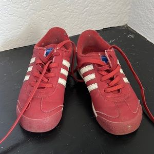 Red Adidas child shoes. Gently used